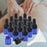 15 Pieces Glass Dropping Bottles Portable Refillable for Perfume Storage 1ml Blue Black